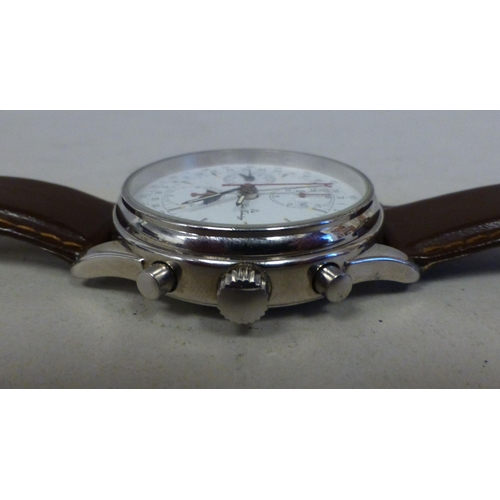 25 - An ETA stainless steel cased, automatic chronograph 7751, calendar moonphase wristwatch, faced by an... 