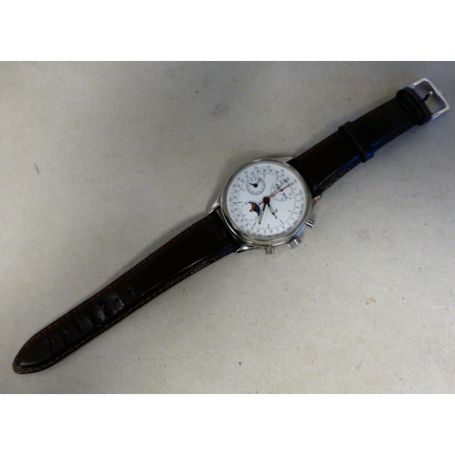 25 - An ETA stainless steel cased, automatic chronograph 7751, calendar moonphase wristwatch, faced by an... 