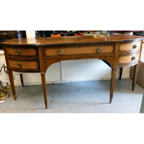256 - An Edwardian string inlaid mahogany breakfront sideboard with an arrangement of four short/one long ... 