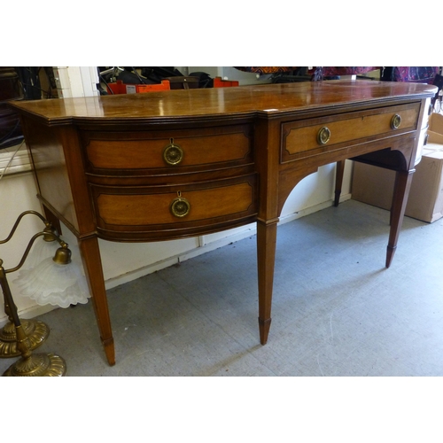 256 - An Edwardian string inlaid mahogany breakfront sideboard with an arrangement of four short/one long ... 