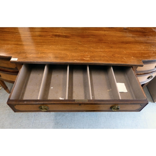 256 - An Edwardian string inlaid mahogany breakfront sideboard with an arrangement of four short/one long ... 