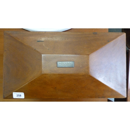 258 - A Regency mahogany tea caddy of sarcophagus form&nbsp; bears an engraved plate&nbsp; 9