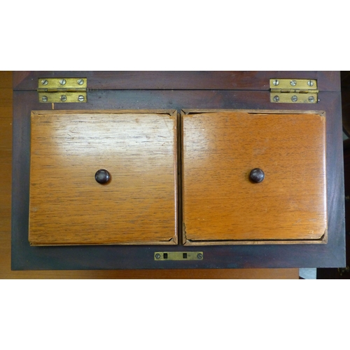 258 - A Regency mahogany tea caddy of sarcophagus form&nbsp; bears an engraved plate&nbsp; 9