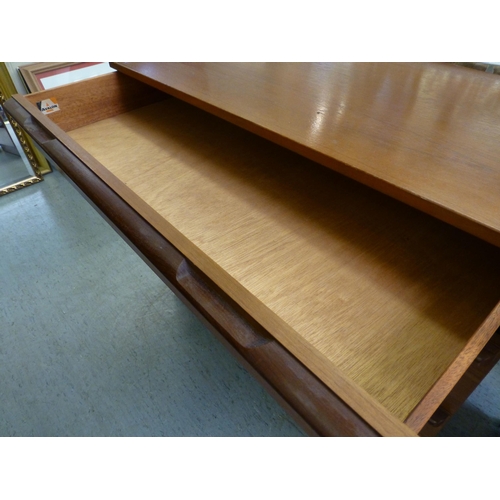 261 - A 1970s/80s Avalon teak dressing chest with four long drawers, on a plinth&nbsp; 26