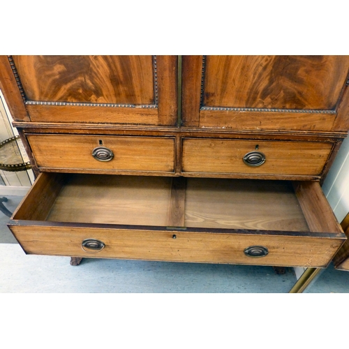 263 - A George III mahogany linen press with two doors, over two short/two long drawers, raised on bracket... 