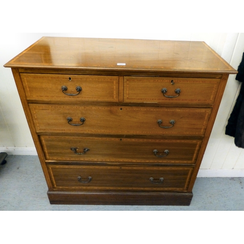 264 - An Edwardian satinwood inlaid mahogany dressing chest with two short/three long drawers, on a plinth... 