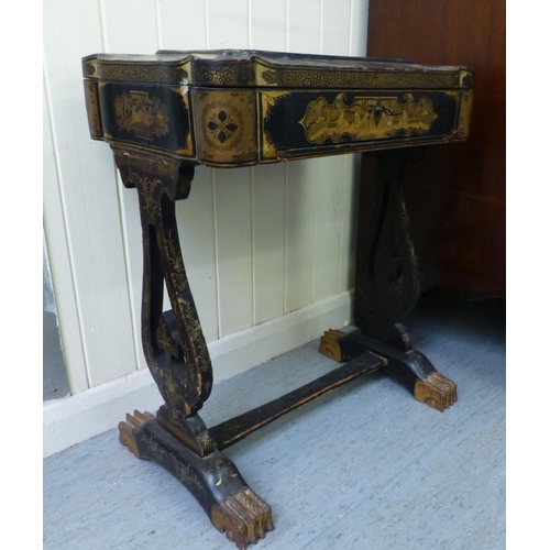 265 - A late Victorian chinoiserie design, black lacquered and gilded work table, the hinged lid enclosing... 