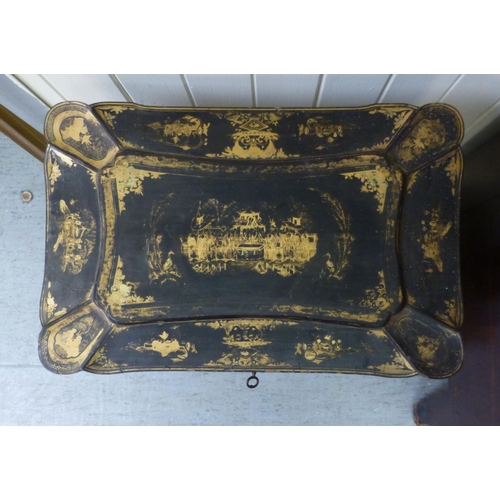 265 - A late Victorian chinoiserie design, black lacquered and gilded work table, the hinged lid enclosing... 