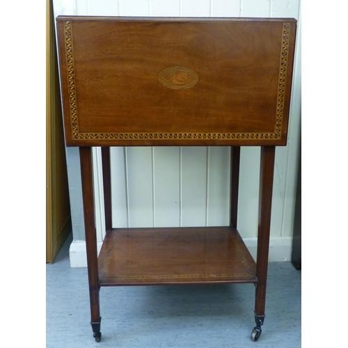 270 - An Edwardian satinwood inlaid mahogany work table with fall flaps and two drawers, raised on square,... 