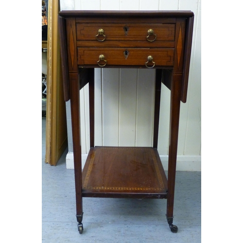 270 - An Edwardian satinwood inlaid mahogany work table with fall flaps and two drawers, raised on square,... 