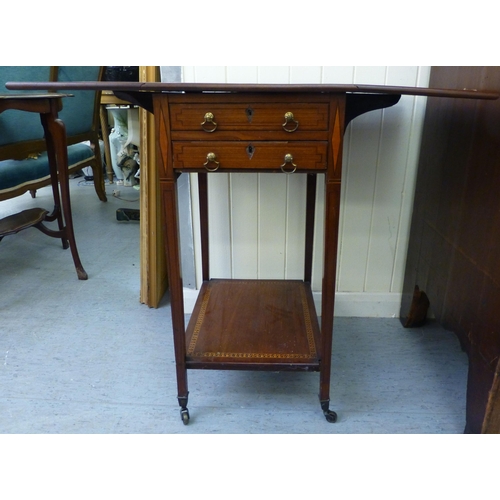 270 - An Edwardian satinwood inlaid mahogany work table with fall flaps and two drawers, raised on square,... 