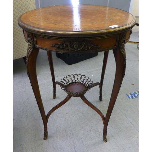 281 - A late 19thC French, brass bound parquetry inlaid kingwood side table, the top raised on cabriole le... 