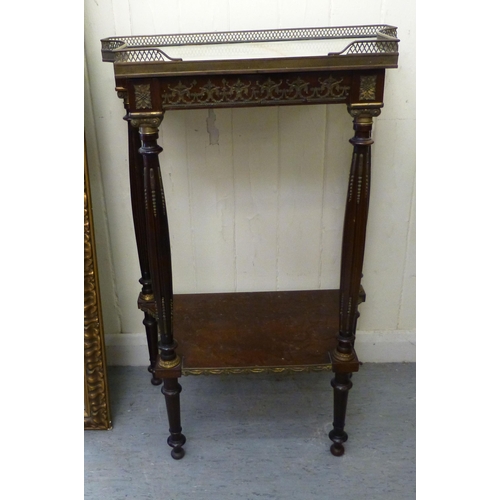 282 - A late 19thC French brass bound mahogany side table, the galleried marble top raised on turned, flut... 