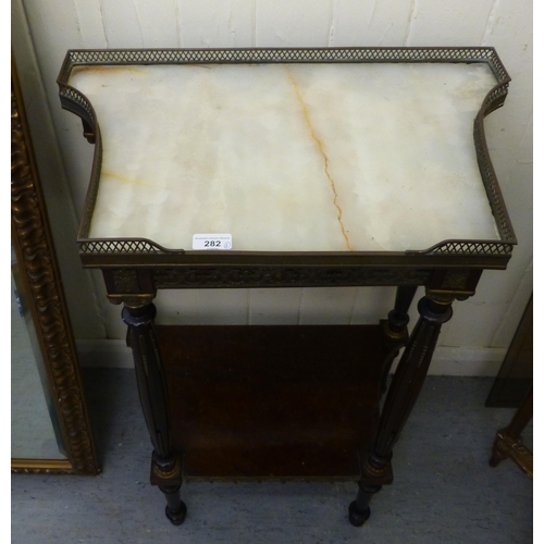 282 - A late 19thC French brass bound mahogany side table, the galleried marble top raised on turned, flut... 