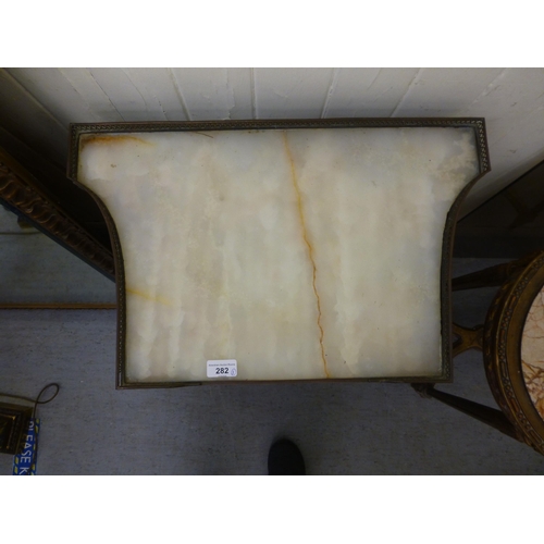 282 - A late 19thC French brass bound mahogany side table, the galleried marble top raised on turned, flut... 