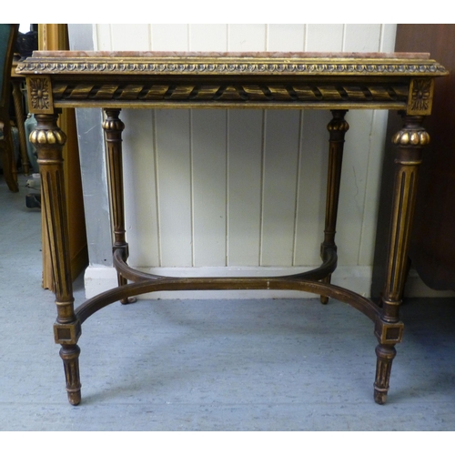 283 - A modern Louis XVI design giltwood side table with a marble top, raised on turned, fluted legs  23