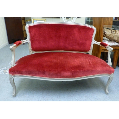 289 - A modern Louis XVI design, grey painted salon settee with an upholstered back and seat, raised on ca... 