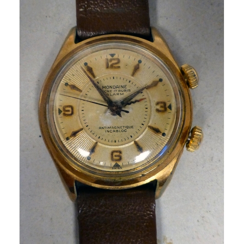 29 - A Mondaine gold plated manual alarm watch, faced by a baton and Arabic dial