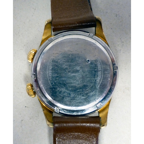 29 - A Mondaine gold plated manual alarm watch, faced by a baton and Arabic dial