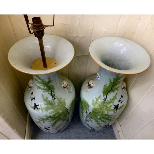 292 - A pair of mid 20thC Chinese porcelain vases, decorated with birds and flora&nbsp; 23