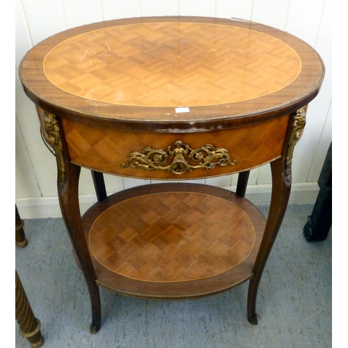294 - A modern gilt overpainted kidney shaped table, the showwood top raised on spiral, fluted legs and bu... 