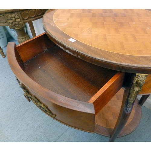 294 - A modern gilt overpainted kidney shaped table, the showwood top raised on spiral, fluted legs and bu... 