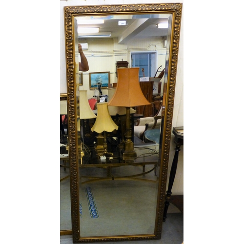 298 - A dressing mirror, in an ornate gilt gesso frame&nbsp; 62