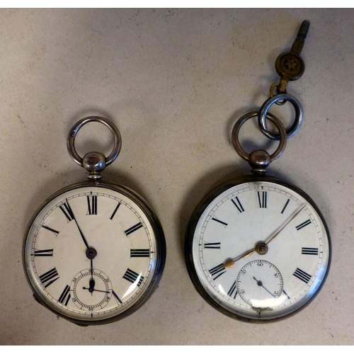 30 - Two similar early 20thC silver cased pocket watches, each faced by an enamelled Roman dial  mixed as... 