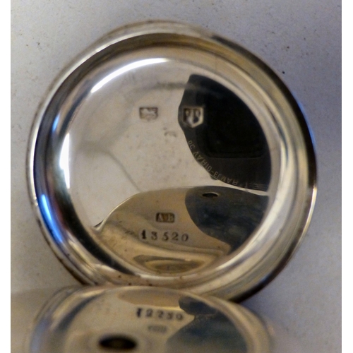 30 - Two similar early 20thC silver cased pocket watches, each faced by an enamelled Roman dial  mixed as... 