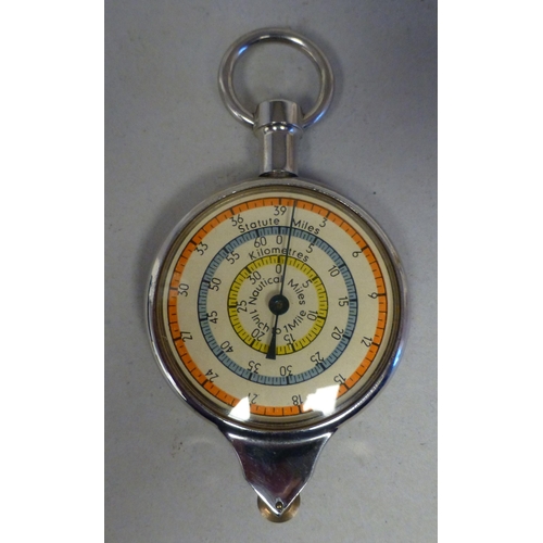 31 - A mixed lot: to include a late 19thC gilt metal cased pocket barometer, faced by an Arabic dial