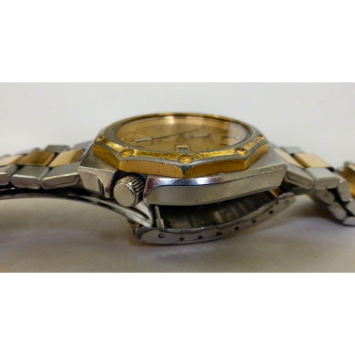 310 - A Seiko Sport 100 stainless steel cased bracelet watch, faced by a baton dial&nbsp;