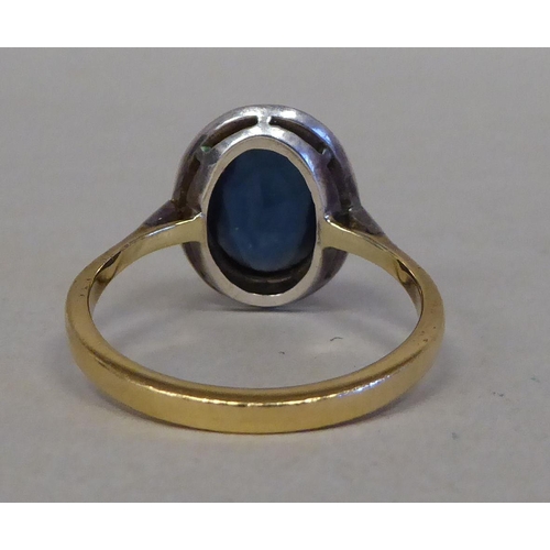35 - An 18ct gold cluster ring, set with blue and white stones&nbsp; (approx. weight 4.9 grams)