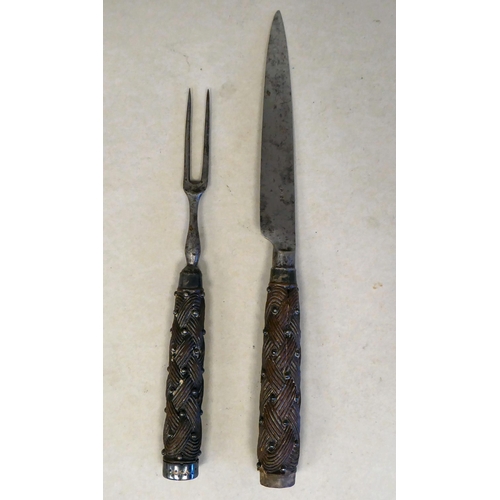 36 - A late 18thC Scottish steel knife and fork, each with a carved rope knot design handle