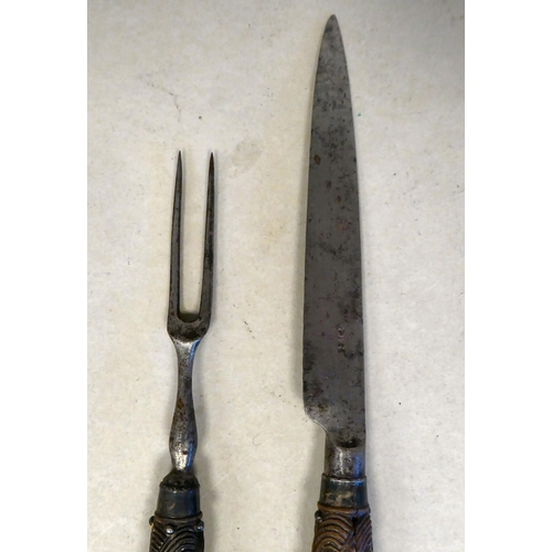 36 - A late 18thC Scottish steel knife and fork, each with a carved rope knot design handle