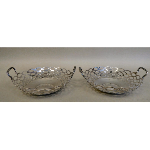 38 - A pair of silver sweet baskets with opposing handles and reticulated sides&nbsp; A&J Zimmerman&n... 
