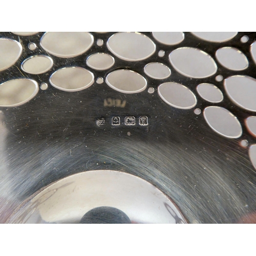 38 - A pair of silver sweet baskets with opposing handles and reticulated sides&nbsp; A&J Zimmerman&n... 