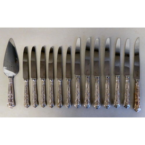 42 - A set of six stainless steel Queens pattern dinner knives, on loaded silver handles; a matching set ... 
