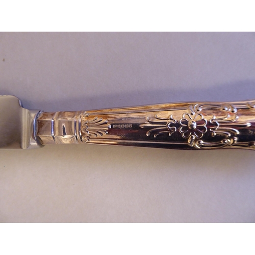 42 - A set of six stainless steel Queens pattern dinner knives, on loaded silver handles; a matching set ... 