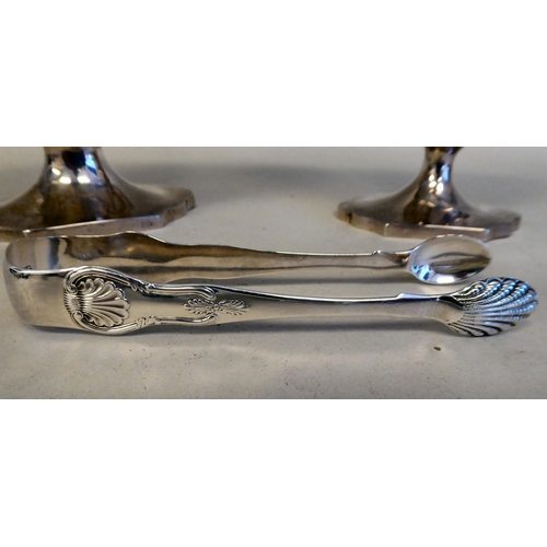 43 - A Georgian silver pedestal sugar basket of oval outline with a swing handle and a matching cream jug... 