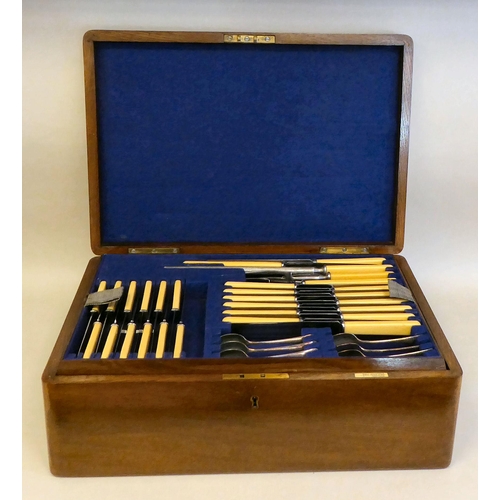 48 - A Walker & Hall stainless steel canteen, comprising twelve place settings, on simulated bone han... 