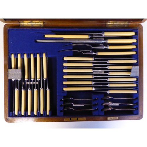 48 - A Walker & Hall stainless steel canteen, comprising twelve place settings, on simulated bone han... 