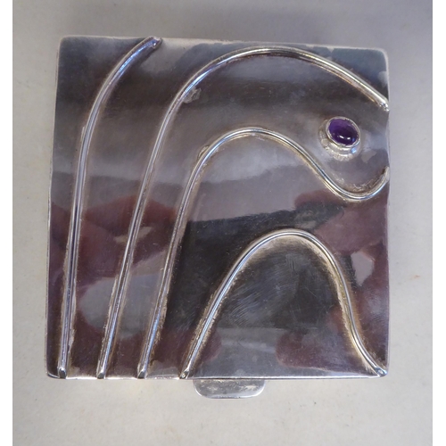 51 - A  modern Arts & Crafts Meredith Jewellery silver trinket box, the hinged lid decorated with swi... 