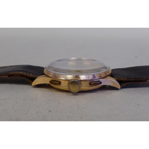 54 - An Orfina chronograph 18ct gold cased, manual wristwatch, faced by an Arabic dial and subsidiary sec... 
