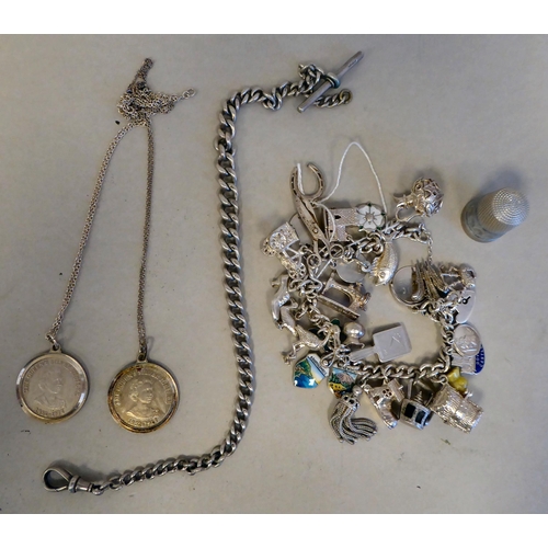 56 - Silver collectables: to include a charm bracelet&nbsp; (approx. gross weight 135 grams)