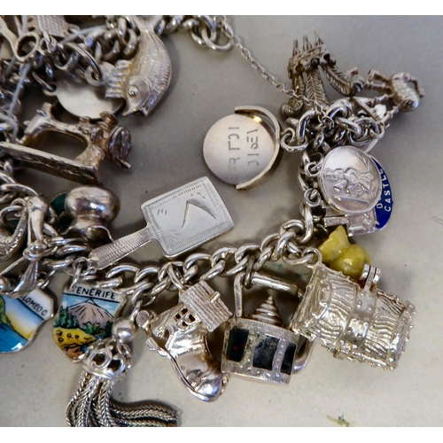 56 - Silver collectables: to include a charm bracelet&nbsp; (approx. gross weight 135 grams)