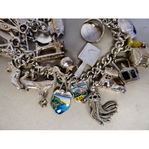 56 - Silver collectables: to include a charm bracelet&nbsp; (approx. gross weight 135 grams)