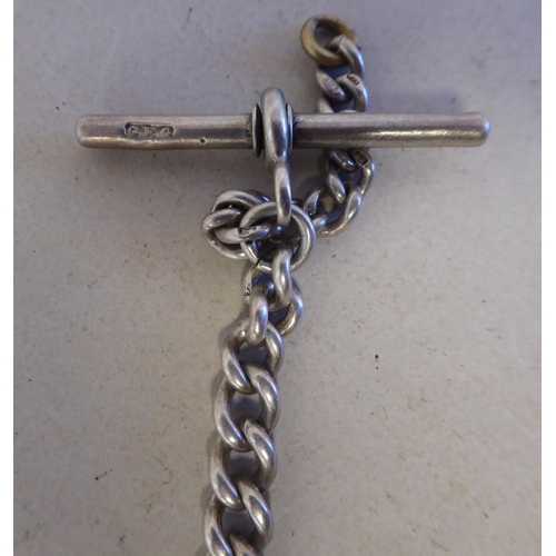 56 - Silver collectables: to include a charm bracelet&nbsp; (approx. gross weight 135 grams)