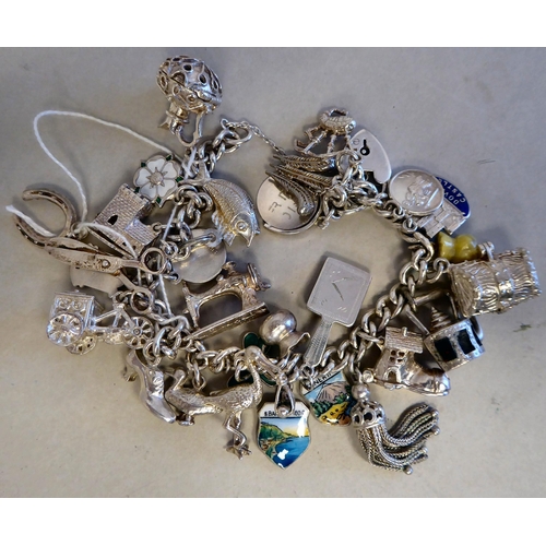 56 - Silver collectables: to include a charm bracelet&nbsp; (approx. gross weight 135 grams)