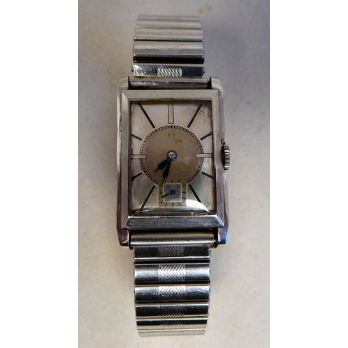 57 - An Omega stainless steel cased manual, bracelet Tank watch, faced by a baton dial and subsidiary sec... 