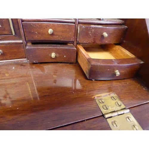 9 - A modern Korean teak Georgian style bureau, in the manner of a trader's sample with brass fittings  ... 